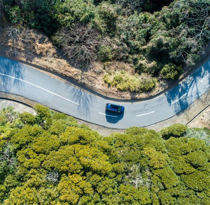 arial view of car on curve in road