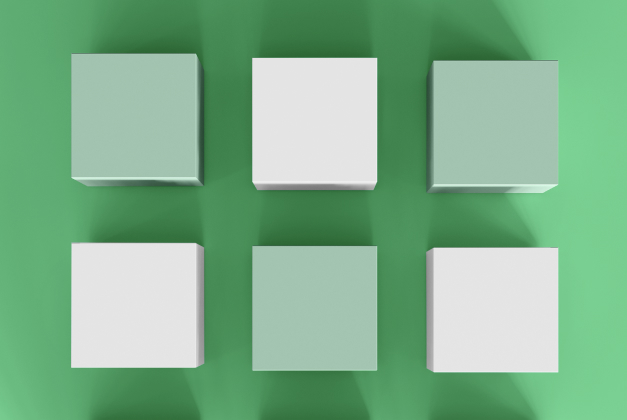 Cubos blancos y verdes sobre un fondo verde