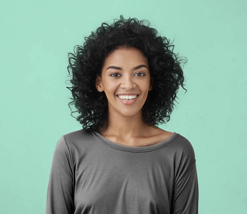 woman smiling on green background