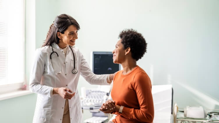 both patients and doctor smiling and talking to each other