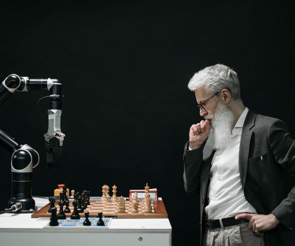 Man playing chess with a robot