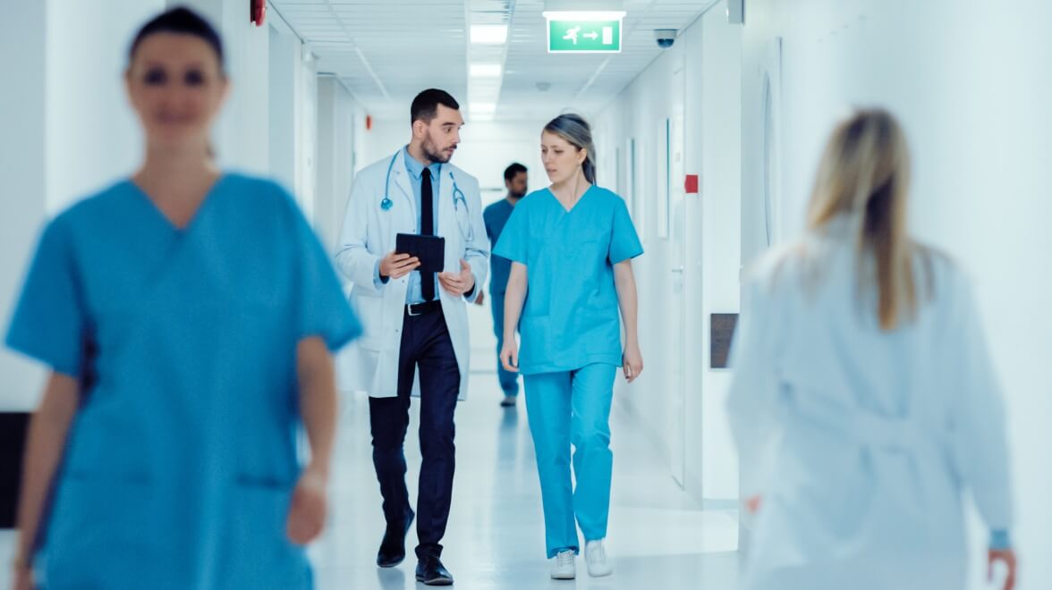 doctors walking down the hall while discussing