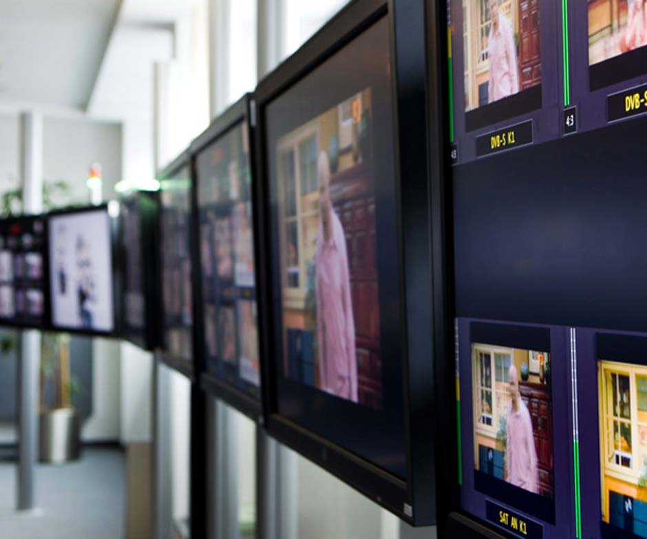 multiple screen monitors set up in a row